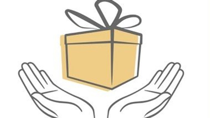 Hands holding a gift box with a bow.
