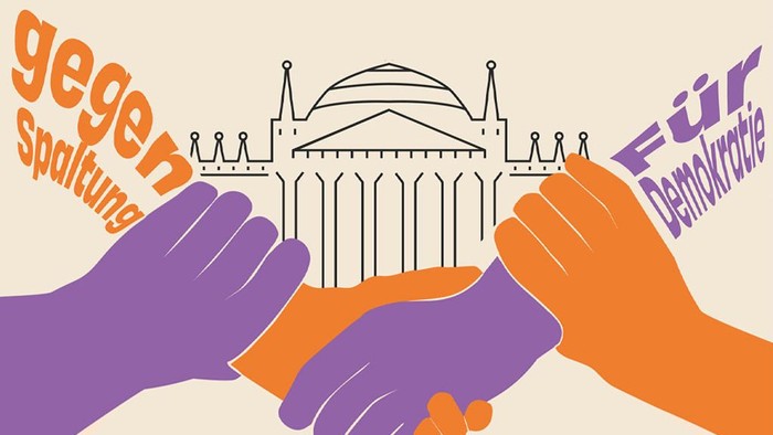 Zwei Hände reichen sich vor dem Reichstagsgebäude die Hand