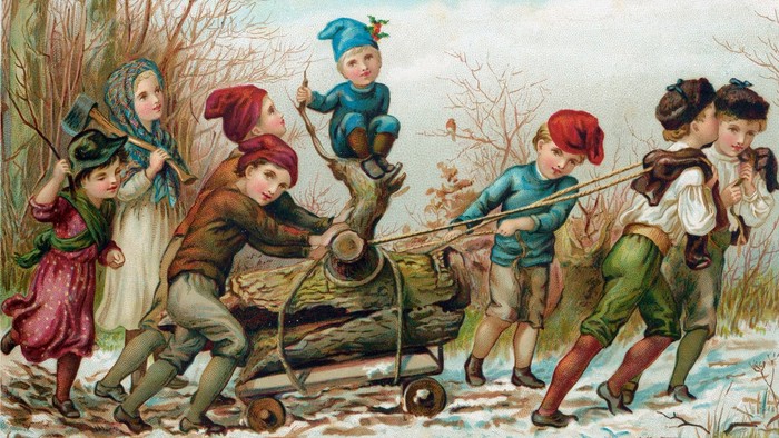 Kinder ziehen einen Schlitten, während ein Mann spielt