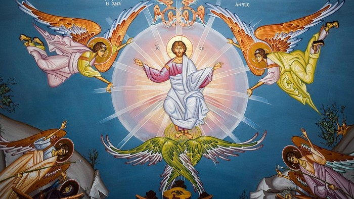 Das Bild zeigt eine religiöse Darstellung mit Engeln und einer zentralen Lichtgestalt.