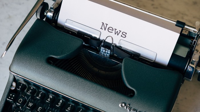 Typewriter with paper reading