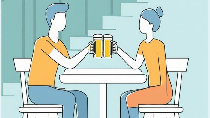 Zwei Personen trinken Bier an einem Tisch