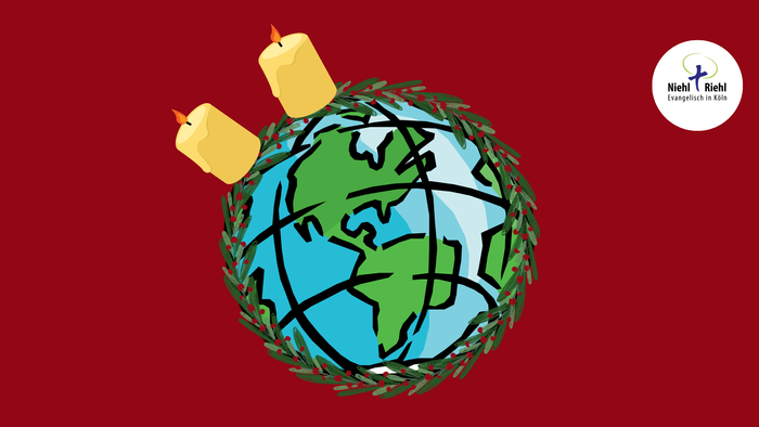 Weltkugel mit Adventskranz und zwei Kerzen