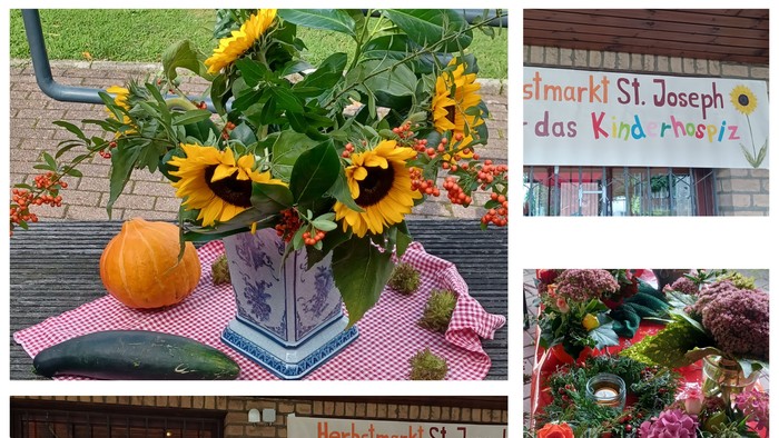 Bunter Marktstand mit Blumen und Marmelade, Frauen in traditioneller Kleidung, Dekoration mit Kürbis und Sonnenblumen
