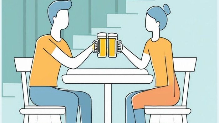 Zwei Personen trinken Bier an einem Tisch