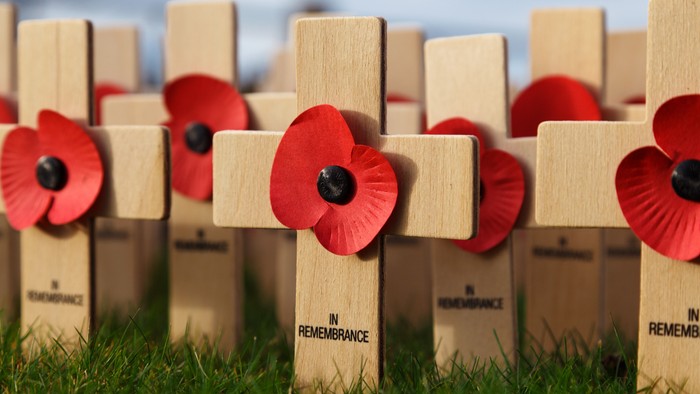Wooden crosses with red poppies and