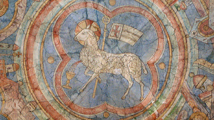 Das Bild zeigt eine detaillierte Darstellung eines Lamm-Mosaiks in einem kreisförmigen Rahmen