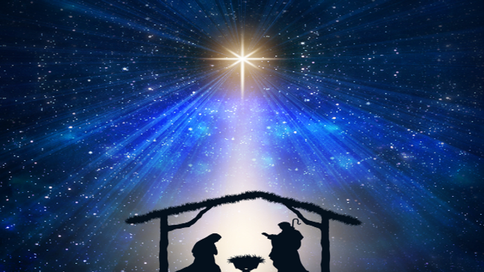 Umriss einer Weihnachtskrippe mit strahlendem Stern darüber, vor sternenklarer Nachthimmelkulisse.