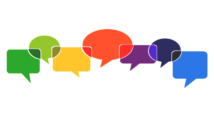 Farbig Sprechblasen die ineinander übergehen und Dialog und Miteinander-Sprechen ausdrücken