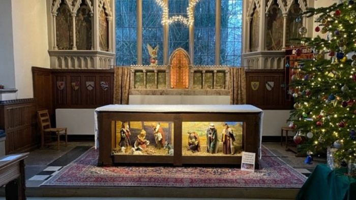 Church altar with nativity scene and Christmas tree