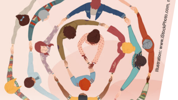 Eine Gruppe von Menschen bildet einen Kreis und hält sich an den Händen