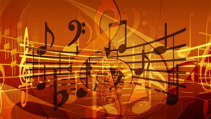 Das Bild zeigt eine abstrakte Darstellung von Noten in warmen Orange- und Gelbtönen.