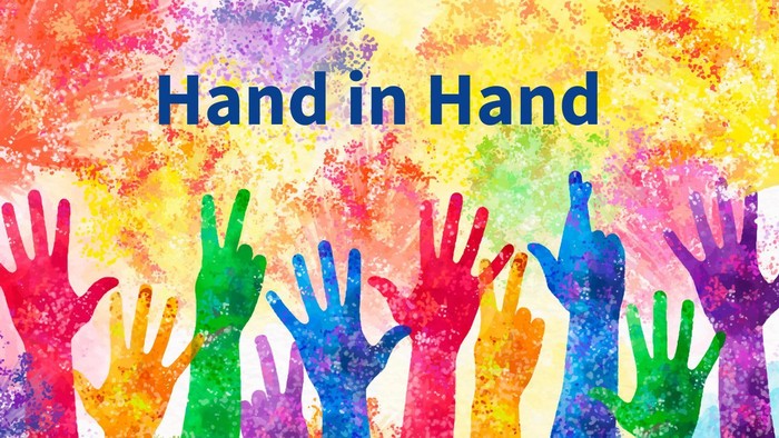 Hand in Hand: bunte Hände mit farbigen Hintergrund