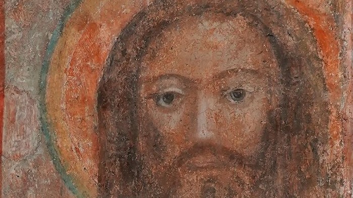 Das Bild zeigt ein altes, religiöses Gemälde eines Mannes mit Heiligenschein.