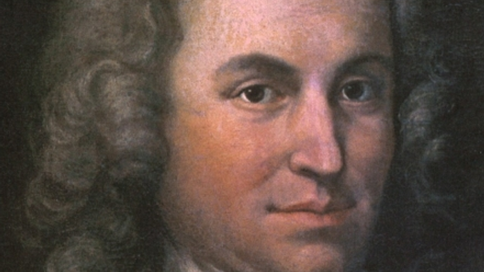 Porträt eines Mannes mit langen, welligen Haaren und ernstem Gesichtsausdruck in Kleidung des 18. Jahrhunderts.