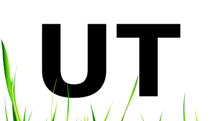 UT für Untertitel. Am unteren Rand der Grafik grasgrüne Grashalme.