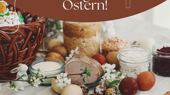 Ein festliches Osterbuffet mit traditionellen Speisen, verzierten Eiern, Brot und Konserven sowie einer fröhlichen Botschaft.