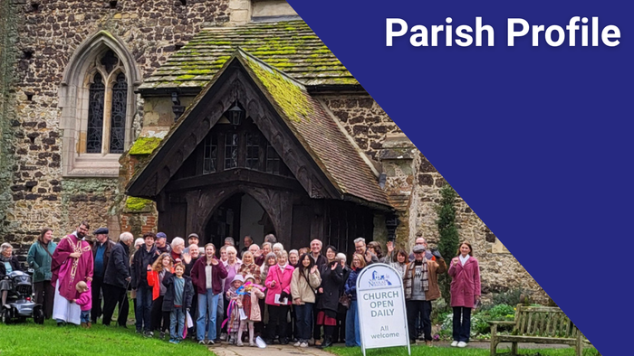 A group gathers outside St Nicolas Cranleigh church for a community or parish event.