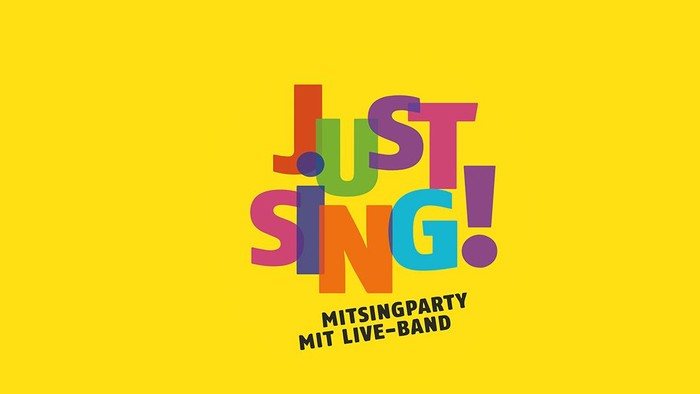 Bunter Schriftzug "Just Sing!" vor gelbem Hintergrund
