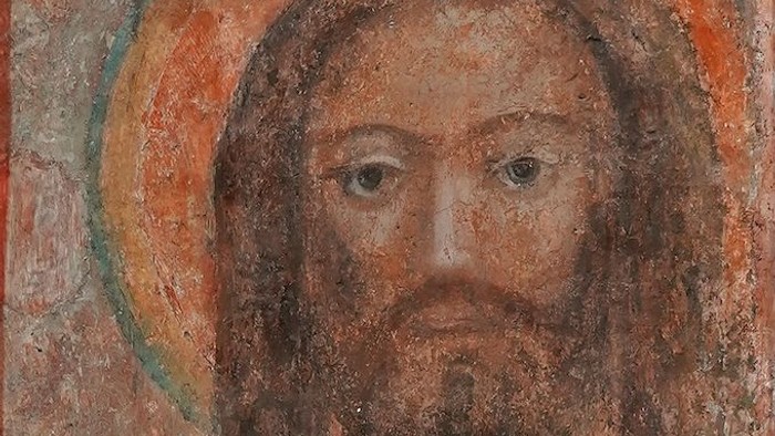 Das Bild zeigt ein altes, religiöses Gemälde eines Mannes mit Heiligenschein.