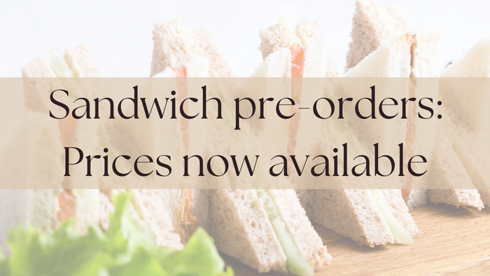 An assortment of neatly cut sandwiches with a notice about available pre-order prices.