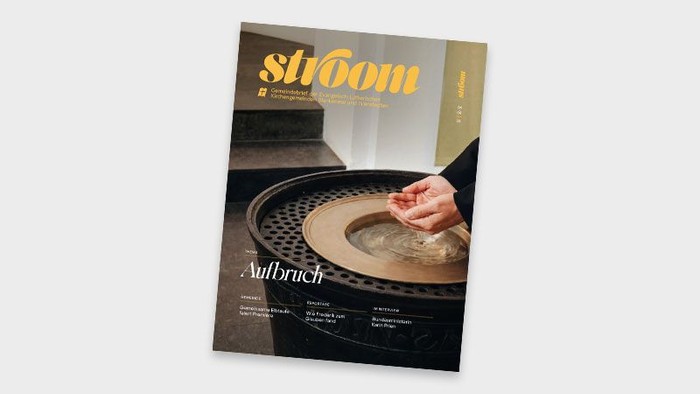 Zeitschriften-Cover mit Händen, die Ton formen, und dem Wort „Aufbruch“ sowie eleganten Designelementen.