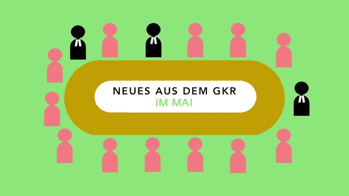 Neues aus dem GKR im Mai: Gruppe von Personen um einen zentralen Text.