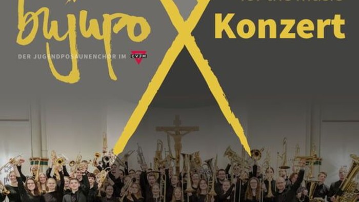 Ein Konzertplakat mit einem großen Posaunenchor und den Daten des Konzerts um ein großes gelbes X