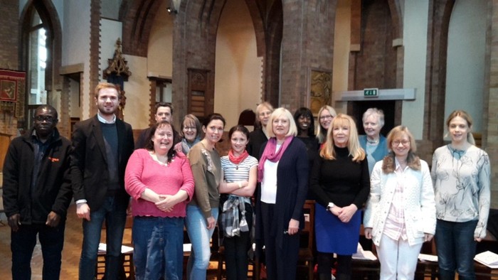 Group of people posing together in a church