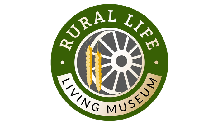 Logo for Rural Life Living Museum featuring a wheel, wheat, and green circular border.