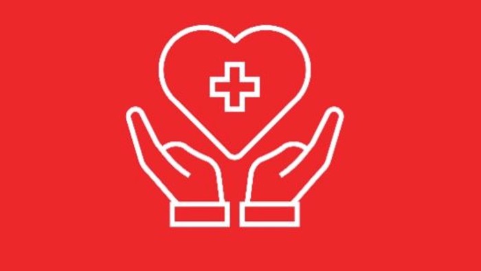 Zwei Hände, die ein Herz mit einem Kreuzsymbol halten, das Gesundheitswesen und Mitgefühl symbolisiert.