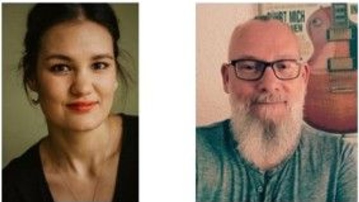 Zwei Personen mit neutralem Gesichtsausdruck, eine Frau und ein bärtiger Mann mit Brille, nebeneinander.