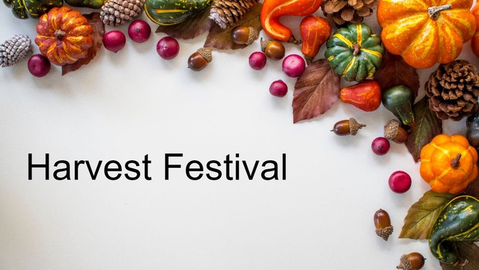 Autumn decorations including pumpkins, gourds, pinecones, and berries arranged around the text