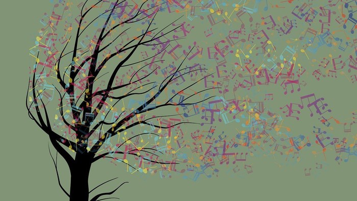 Ein Baum mit Musiknoten als Blätter vor grünem Hintergrund