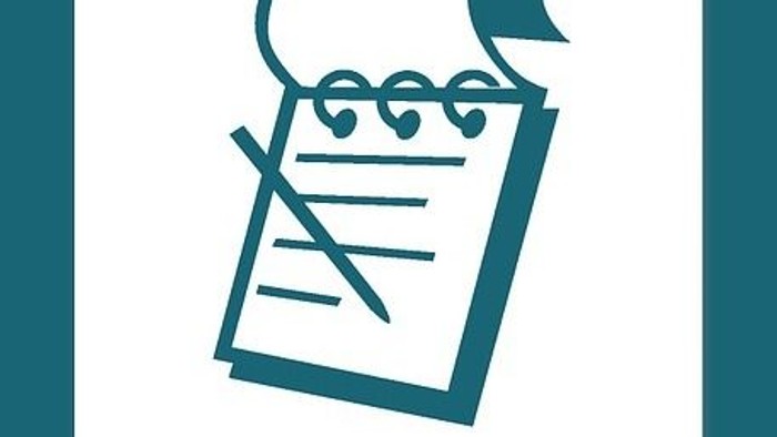 Ein Notizblock mit Stift und aufgeschlagener Seite