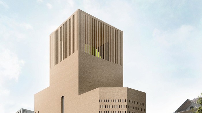 Modernes Gebäude mit markanter Fassade und vertikalen Linien, umgeben von weiteren Gebäuden und Bäumen