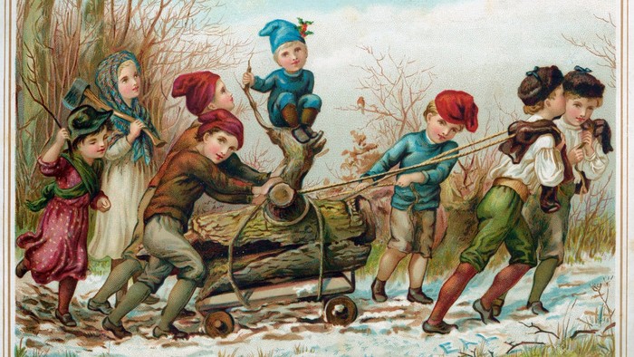 Kinder ziehen einen Schlitten, während ein Mann spielt