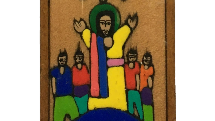 Das Bild zeigt ein buntes Holzkreuz mit Kindern und der Erde