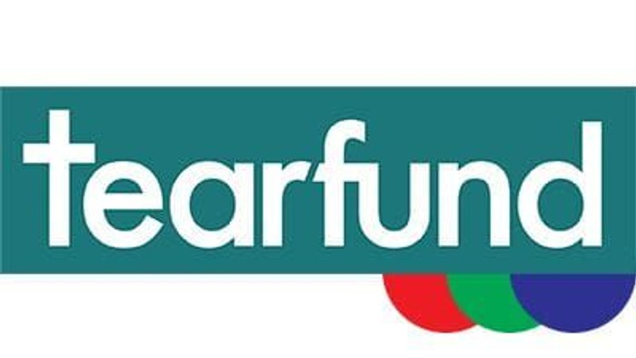 Tearfund logo with colorful semi-circles