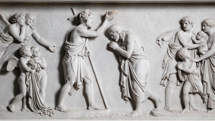 Billedet viser en relief med several figurer i dramatiske pose.