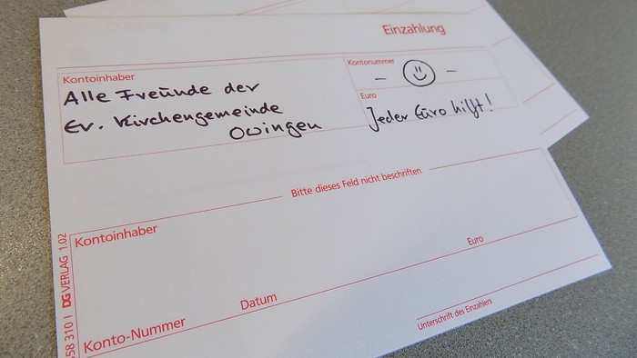 Ein Formular mit handschriftlichen Eintragungen und einem Smiley.