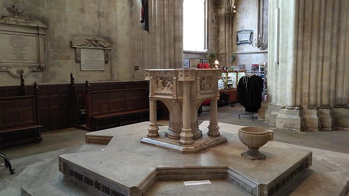 Stone baptismal font in a church.