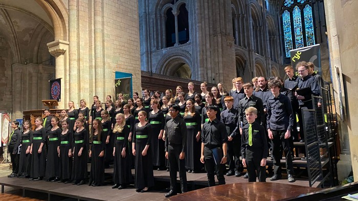 Large choir performing in grand cathedral