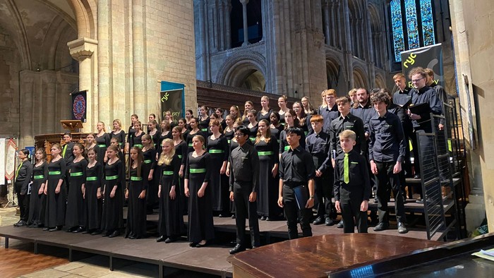 Large choir performing in grand cathedral
