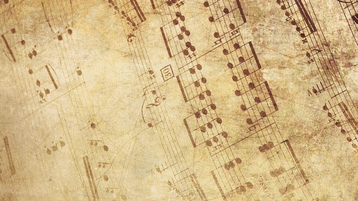 Das Bild zeigt ein altes, vergilbtes Notenblatt mit Noten und Symbolen.