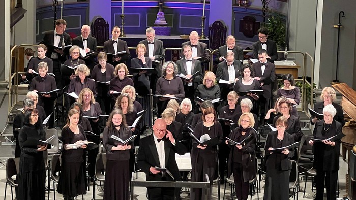 Large choir performing in grand church setting