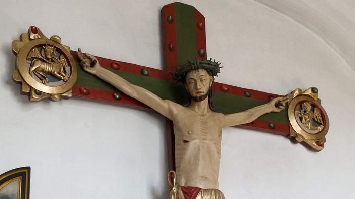 Krucifikset på veggen med Jesus Kristus