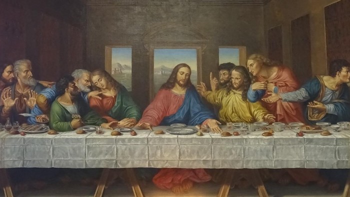 Billedet viser Jesus og hans disipler ved en lang bord.