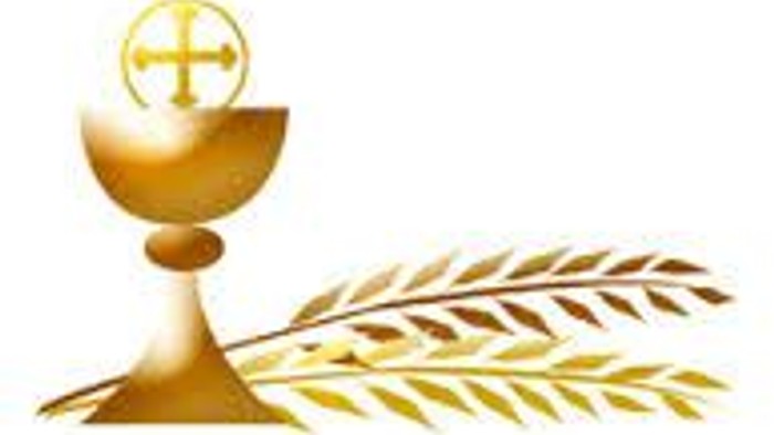 Golden chalice with cross and palm frond, symbolizing Christian sacrament and celebration.