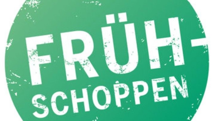 Das Bild zeigt ein grünes Siegel mit dem Text "FRÜH-SCHOPpen".